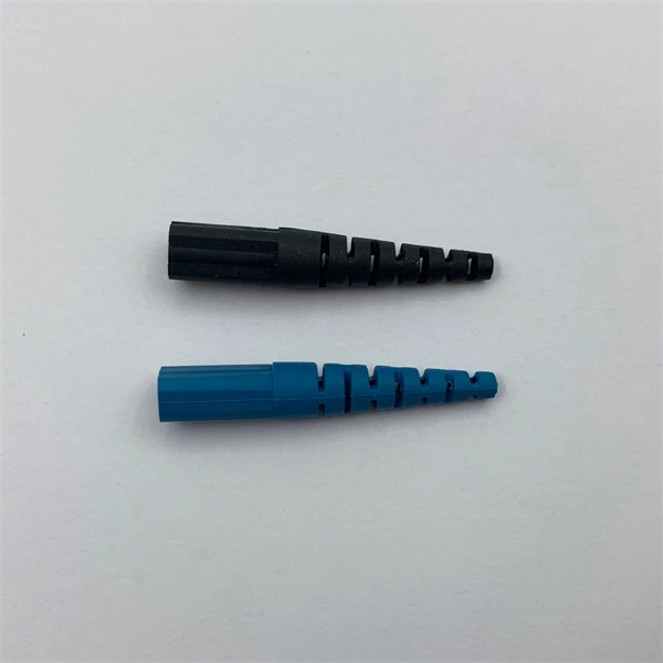 What does the construction of optical fiber cables for communication include